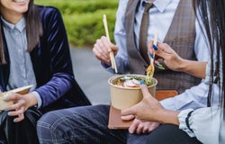 weirdest employment laws from around the world - office workers eating lunch outside