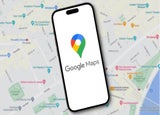 A smartphone device against a backdrop of a traditional map displaying the Google Maps logo.