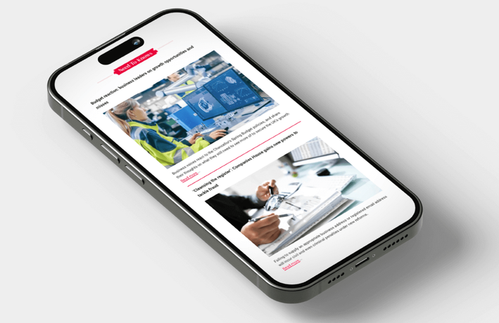 Woman carrying box of possessions out of an office