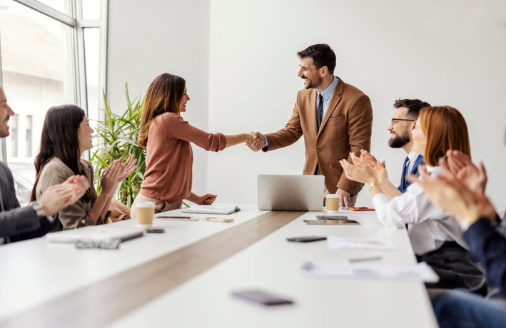 Leaders CEO bosses shaking hands boardroom office